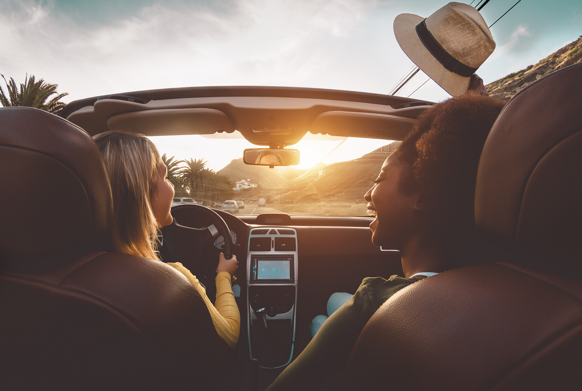 people in a convertible car